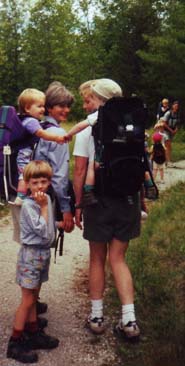 women carrying babies on backs